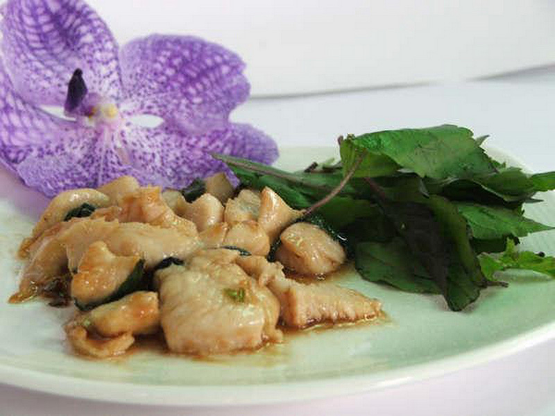 Chicken with basil leaves